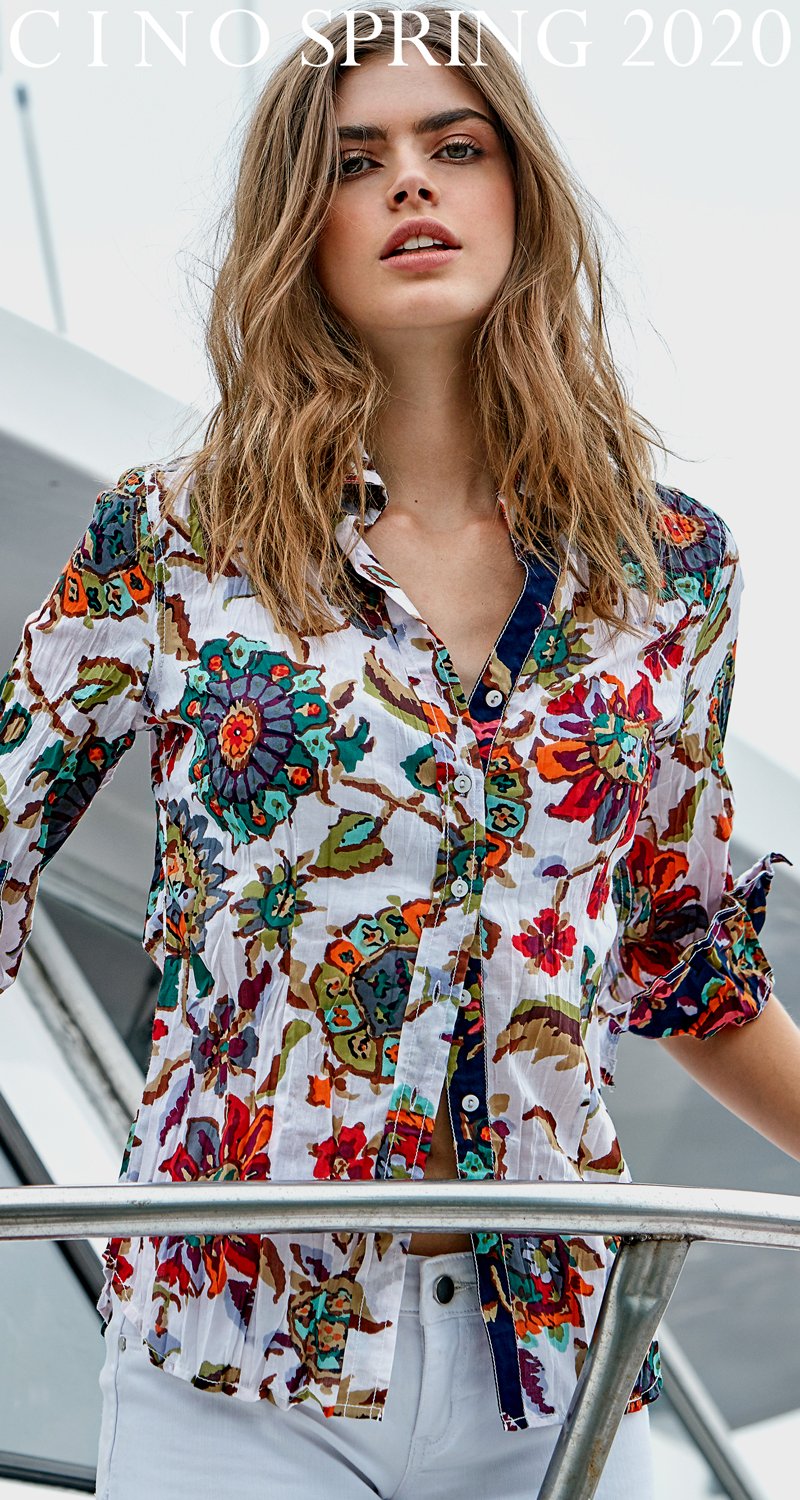 A model wears a CINO Barbados White button-down shirt.