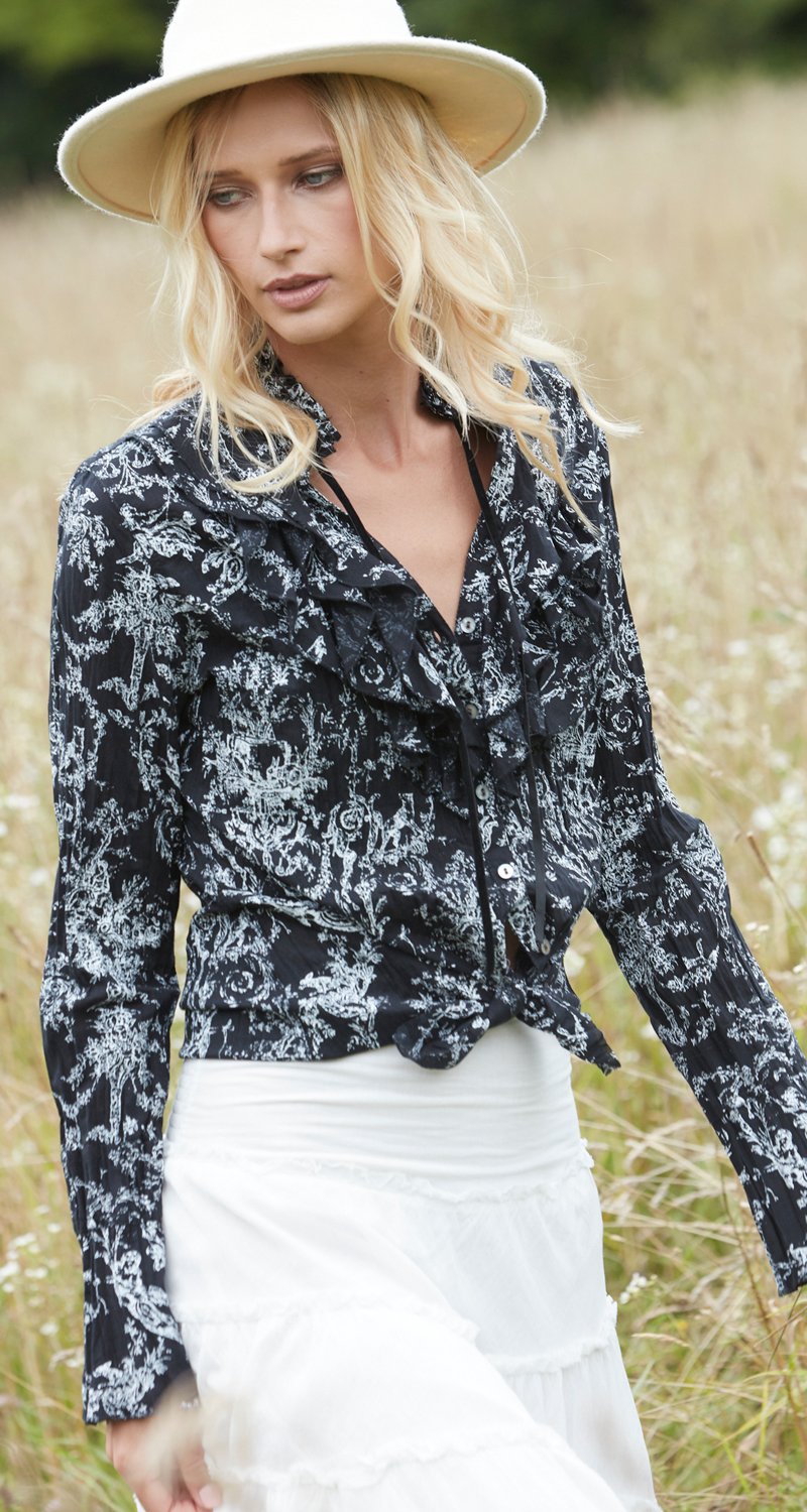 A model wears a CINO Vintage Toile Black button-down ruffle shirt.