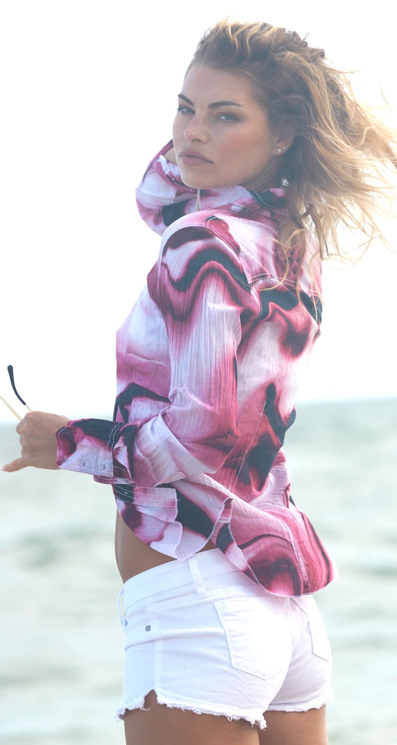 A model wears a CINO Swirl Vibrant Pink button down shiirt.
